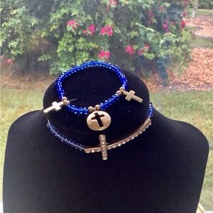 Beaded bracelets with crosses stretchy. In excellent condition. Made of …